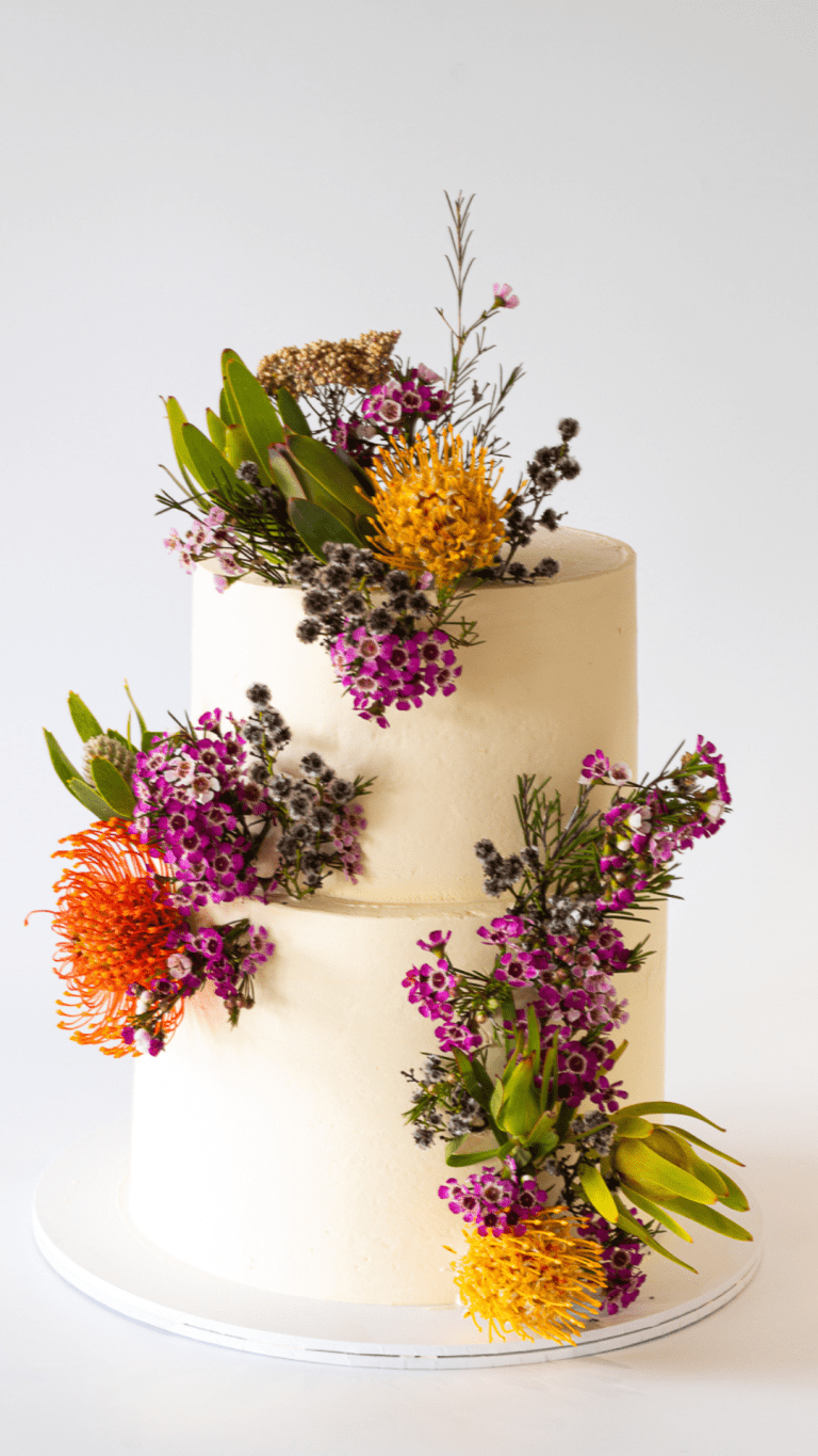 two tier cake with wild flowers