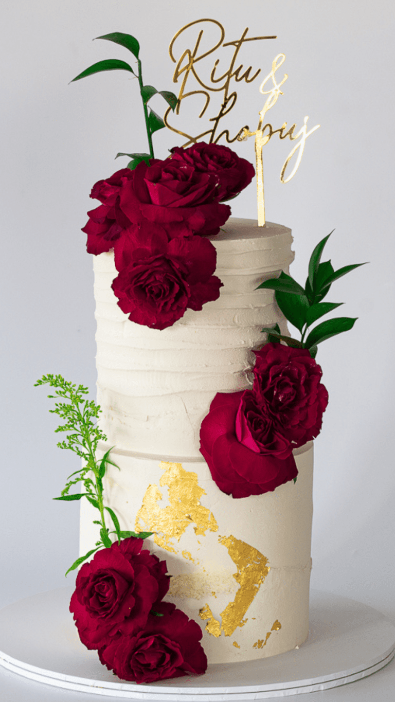 two tier wedding cake with red roses